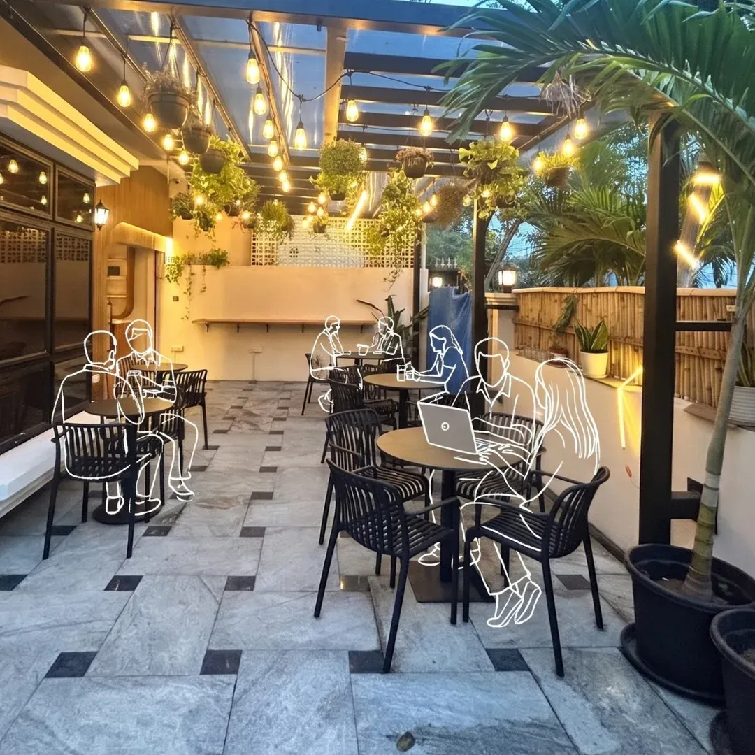The Anamour courtyard with line drawings of people working on laptops and talking over coffee